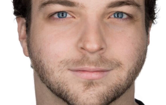 Man with blue eyes and beard.